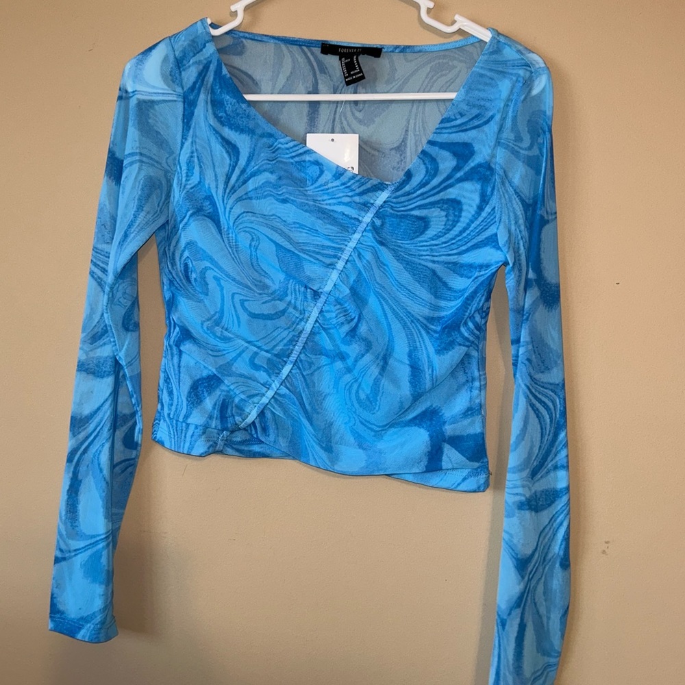 Women’s going out long sleeve shirt. Blue mesh. Never been worn.